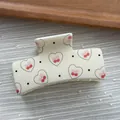 Detail view of a white square hair claw clip with heart cherry and polka dot prints. - Cube Shape / L / Cream White Heart