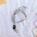 Minimalist grey nylon lanyard featuring a durable gold metal hook for ID card holders - Solid Color / Gray