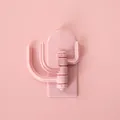 Cute pink rotating wall hook with 3 prongs featuring a punch-free adhesive design - Pink