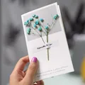 Elegant minimalist greeting card decorated with real dried blue baby's breath flowers - Gypsophila (Blue)
