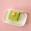 Lime green AirPods protective case with cute 3D yellow duck and gold metallic keychain. - Duck With Orange Feet - For AirPods 1/2 / Grass Green