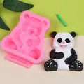 Detail view of 3D cartoon panda silicone mold with a finished resin panda figurine - Pink