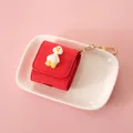 Red protective AirPods case in premium leather featuring a cute white duck ornament - Duck With Yellow Feet - For AirPods 1/2 / Red
