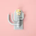 Cute cartoon dog adhesive wall hook with three rotatable hooks in light blue color. - Dog