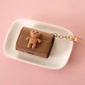 Brown leather-like AirPods case with cute 3D teddy bear and gold keychain - Brown Bear - For AirPods 3/Pro / Brown