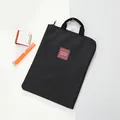 Black minimalist waterproof laptop bag with durable handles for business and school - Black