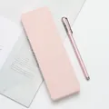 Elegant minimalist pastel pink stationery set featuring a sleek pencil box and matching pen. - Pink