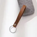Handmade brown leather loop keychain featuring a polished silver metal ring and stud - Coffee