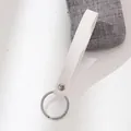 Minimalist white leather loop keychain with silver metal ring and rivet detail - White
