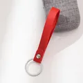 Handmade vibrant red leather strap keychain with a sleek silver metal split ring - Red