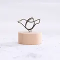 Minimalist Zakka style bird-shaped wire memo holder with a rustic round wooden base - Bird
