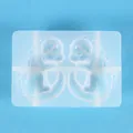 Detail view of silicone resin mold featuring two symmetrical cartoon dinosaur shapes. - Baby Dragon Relief Style (60-860) / Dragon Mold 60-860