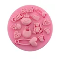 Close-up of pink silicone mold with baby girl, rabbit, and milk bottle patterns. - Pink