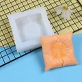 Detailed view of square pillow silicone mold with finished orange gypsum sample - White