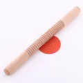 Detail of wooden threaded rolling pin for creating textured patterns on pastry dough. - Spiral Style (82091)