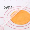 Detailed view of clear acrylic rolling pin creating brick patterns on orange fondant - Brick Wall Relief Texture (52014)