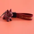 Burgundy resin French Bulldog keychain with leather wrist strap and X BOOM gold logo - French Bulldog Style / Red