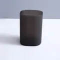 Sleek translucent dark grey minimalist desktop container for office or bedroom storage - Oval Storage Cylinder / Matte Black
