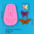 Silicone mold for three butterfly sizes showing dimensions for fondant cake decoration - Oval Triple Butterfly (50-3566) / 50-3566-A (11x7x1.3cm) / Pink