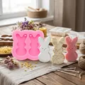 Detail view of pink 2-cavity rabbit silicone mold with finished candles and soaps - Pink