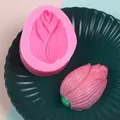 Detailed view of 3D flower bud silicone mold with a finished pink soap replica - Pink