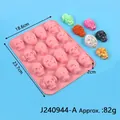 Detailed view of skull silicone mold with dimensions 18.6x23.7x2cm for Halloween baking - 15-Cavity Funny Skull Mold (J240944-A) / Pink