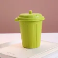 Compact green desktop trash can with lid used as a stylish office pen holder storage - Creative Trash Can Style / Green