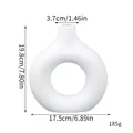 Minimalist white donut-shaped faux ceramic vase with size dimensions and weight specifications. - M / White