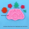 Macro view of a pink silicone mold showing various flower and leaf patterns with sizes - Leaf Combination (50-3205-A)