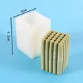 Detail view of the silicone candle mold and textured pillar wax with size markings - Cylindrical Cluster Style (50-2484-D)