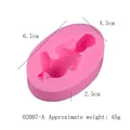 Detailed dimensions and weight specifications for the baby-shaped pink liquid silicone mold - 02007-A Pink