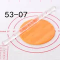 Detailed view of clear acrylic floral rolling pin embossing pattern on orange fondant. - Lush Flower Scroll (53-07)