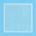 Detailed close-up of a white geometric herringbone pattern stencil for cake baking. - Herringbone Geometric Style (81037) / 13x13cm