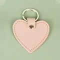 Porte-clés en cuir rose pâle en forme de cœur avec texture grainée et anneau métal - Cœur / Cœur Orange
