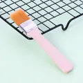 Nylon pastry brush with orange bristles and pink handle for baking and BBQ - Size 4