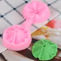 Detail view of 3D flower petal silicone mold with molded green fondant leaf - Petal Leaf Linked Double Sided Mold (50-118-A) / Pink