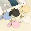 Lot de porte-clés ronds en simili cuir avec pompons assortis et anneau doré élégant - Style Rond à Glands / 5 Pièces / Multicolore