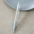 Minimalist clear retractable gel pen featuring a comfortable light grey soft rubber grip - 0.5mm / Gray