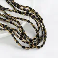Nahaufnahme von facettierten schwarzen Glasperlen mit elegantem Goldrand-Finish - 1 Strang (Ca. 50 Stk/32cm) / Schwarz