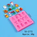 Moule de Noël en silicone rose avec breloques en résine en forme de renne, sapin et Père Noël. - Moule Série de Noël 12 Cavités (50-2772-A)