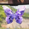 Detailed view of a purple acrylic crystal butterfly pendant hanging in a car mirror. - Faceted Crystal Texture Purple Butterfly