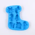 Blue Christmas stocking shaped silicone mold featuring snowman, tree, and santa designs. - Sock Shape 7-Cavity Style (J2761) / Blue
