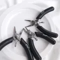 Close-up of mini stainless steel jewelry pliers set with black non-slip handles. - 3-Piece Set (PH 精工) / 1 Set