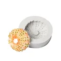 Close-up of sea urchin silicone mold and a finished coral-colored fondant piece. - Sea Urchin Style (50-858-B) / Gray