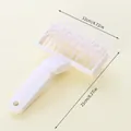 White plastic pizza dough docker roller tool for professional baking tasks - Large Dough Docker Style (04028) / White