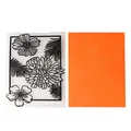 Close-up detail of floral embossing folder and its embossed effect on orange paper sheet - Style B Chrysanthemum Floral (57150)