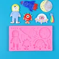 Detailed view showing the dimensions of the astronaut and rocket silicone mold - Space Theme 6-in-1 Pink Mold (50-3623-A) / 50-3623-A / Pink