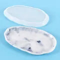 Macro detail of irregular oval silicone mold and a finished marble effect resin tray - Oval Tray (60-712)