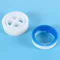 Close-up of a round silicone resin mold beside a finished blue and white craft ring. - Round Storage Box Middle Body Mold (60-763)