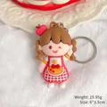 Cute cartoon girl keychain featuring a red apple hat and pink dress bag accessory - Apron Girl / 6x3.5cm